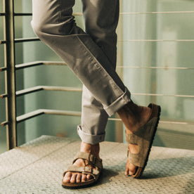 fit model wearing The Slim All Day Pant in Aluminum Bedford Cord, cuffed with birks