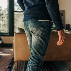 fit model wearing The Slim Jean in Organic Selvage 12-month Wash, back pocket shot
