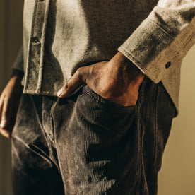 our fit model wearing The Camp Pant in Charcoal Corduroy—cropped shot, hand in pocket