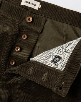 material shot of buttons and map interior , Bottoms by Taylor Stitch