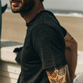 our fit model wearing The Merino Tee—in our black colorway, cropped shot