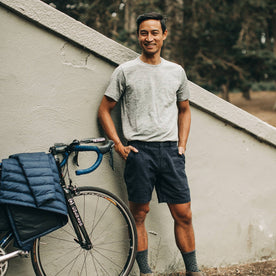 our fit model wearing The Merino Tee—in our grey colorway with his bike