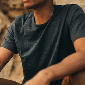 our fit model wearing The Merino Tee—in our navy colorway, cropped shot of chest