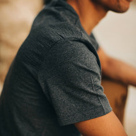 our fit model wearing The Merino Tee—in our navy colorway, cropped shot of shoulder 