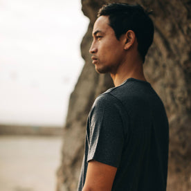 our fit model wearing The Merino Tee—in our navy colorway, looking left