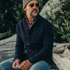 our fit model wearing The Port Jacket in Indigo Sashiko—sitting down, looking right