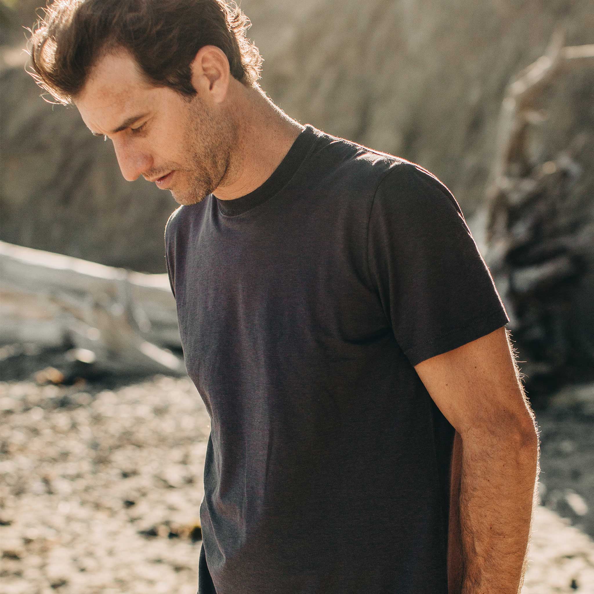 our fit model wearing The Standard Issue Tee in Charcoal Hemp—cropped shot head down, Knits by Taylor Stitch
