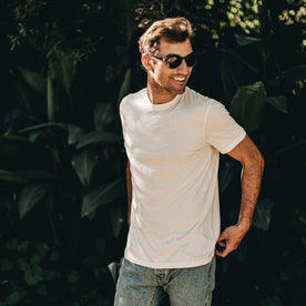 our fit model wearing The Standard Issue Tee in Natural Hemp—hand near pocket shot