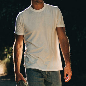 our fit model wearing The Standard Issue Tee in Natural Hemp—cropped shot chin down