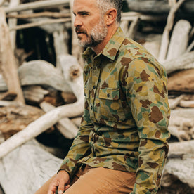 our fit model wearing The Yosemite Shirt in Arid Camo—cropped shot of left shoulder and chest