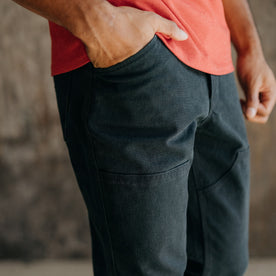 fit model wearing The Chore Pant in Coal Boss Duck, hands in pockets