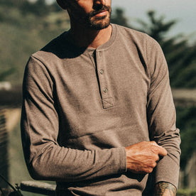 fit model wearing The Heavy Bag Henley in Espresso, cropped nose down