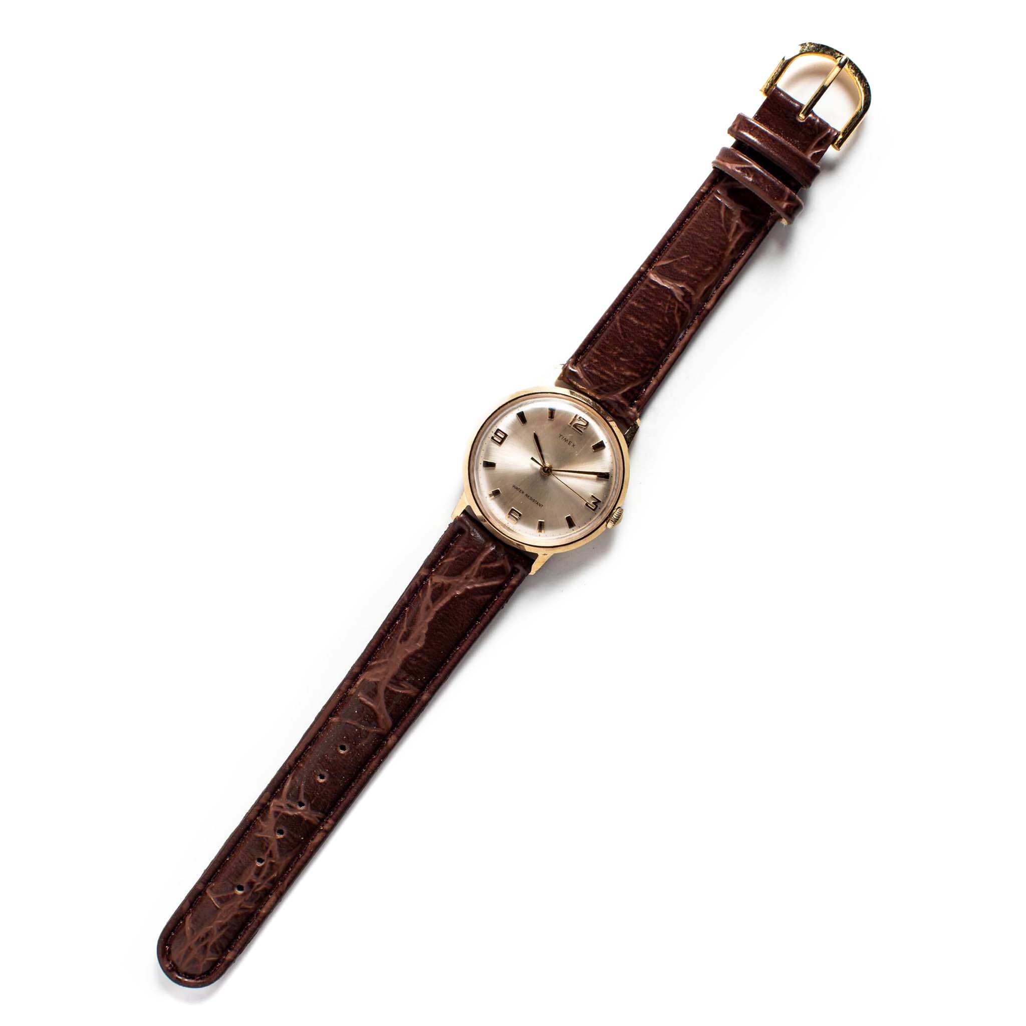 flatlay of the 1969 Timex Marlin, Accessories by Taylor Stitch