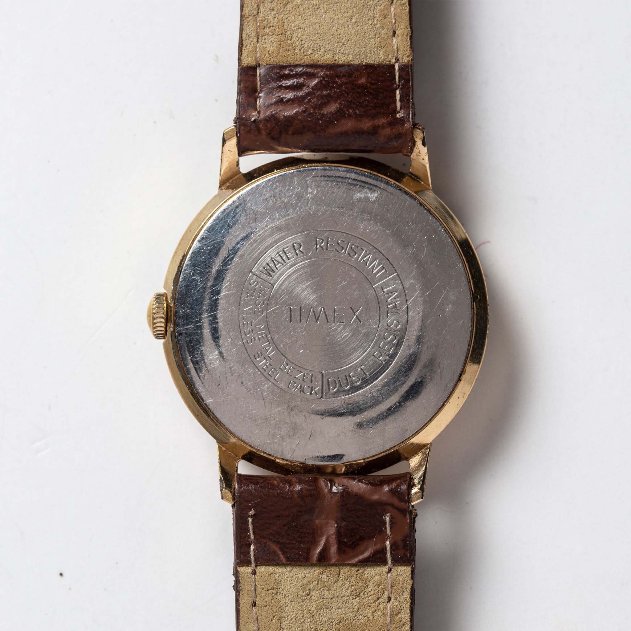 flatlay of the 1969 Timex Marlin, shown from the back, Accessories by Taylor Stitch