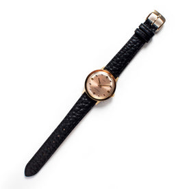 flatlay of The 1972 Timex Marlin Gold, Accessories by Taylor Stitch