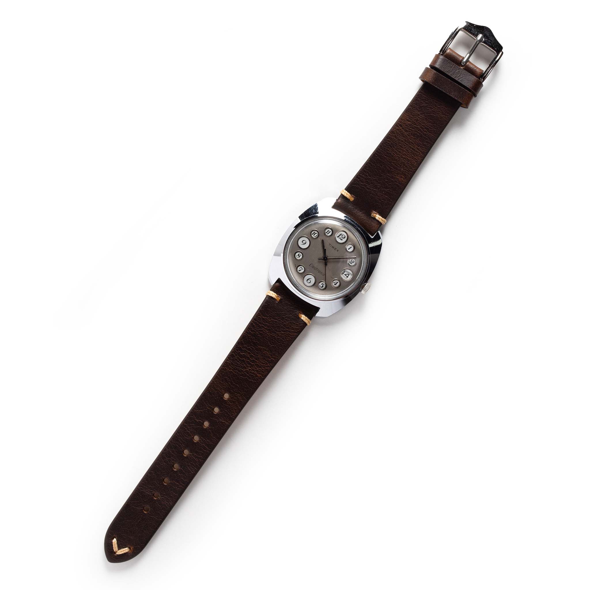 flatlay of The 1974 Timex Electronic "Rotary" Calendar, Accessories by Taylor Stitch