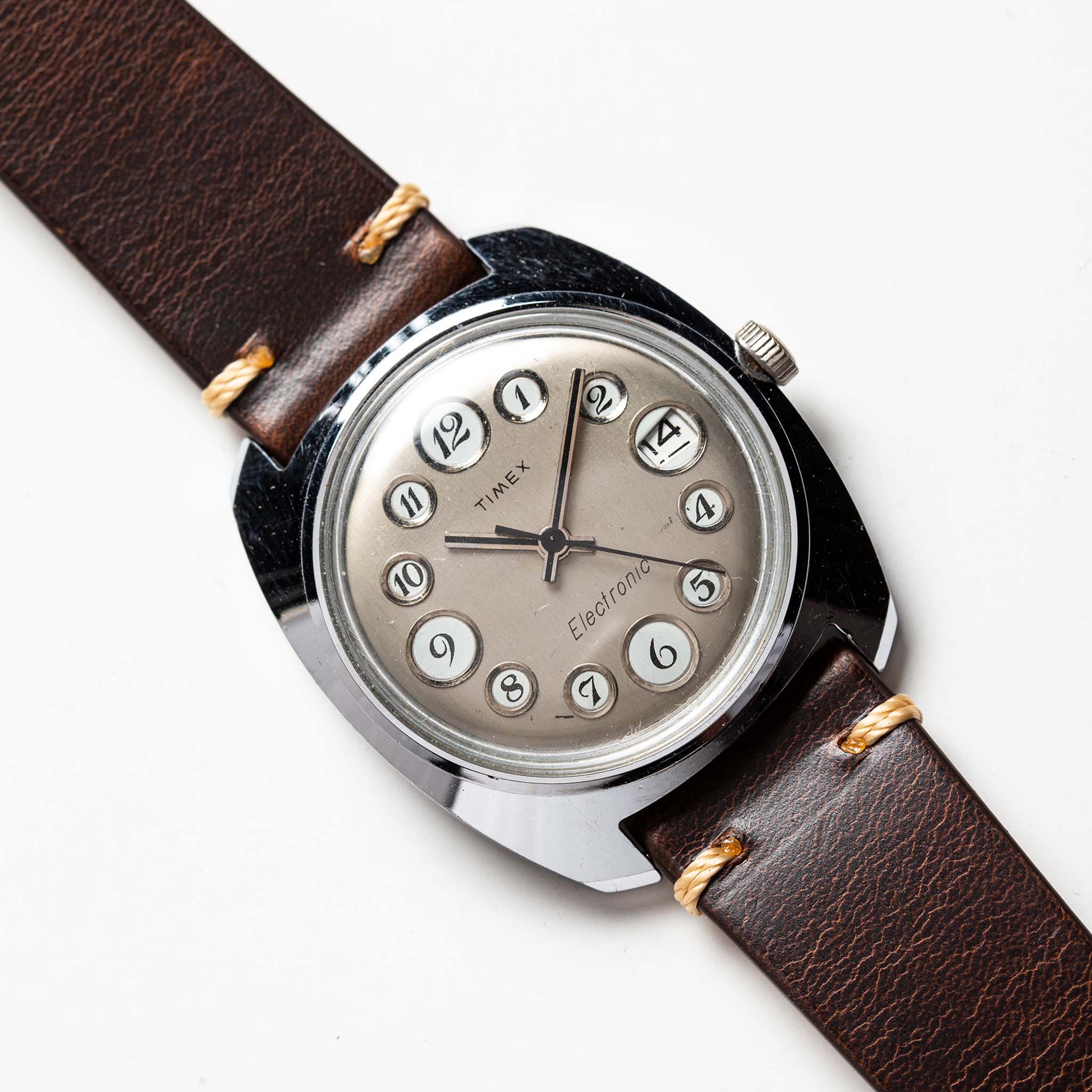 material shot of the watchface on The 1974 Timex Electronic "Rotary" Calendar, Accessories by Taylor Stitch