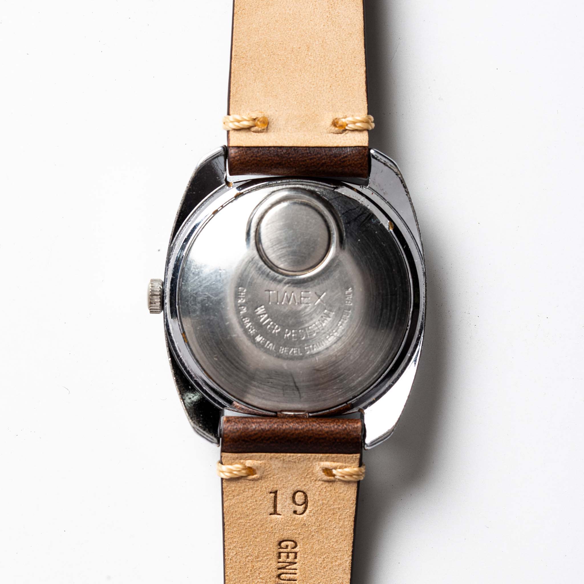 material shot of the back of The 1974 Timex Electronic "Rotary" Calendar, Accessories by Taylor Stitch