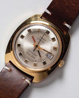 flatlay of the 1975 Timex Electric Dynabeat Time Zone,s hown close up, Accessories by Taylor Stitch