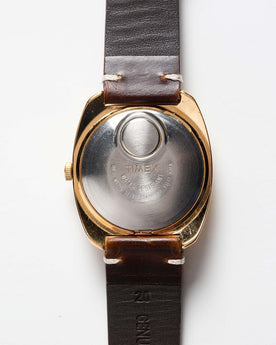 flatlay of 1975 Timex Electric Dynabeat Time Zone, shown from back, Accessories by Taylor Stitch