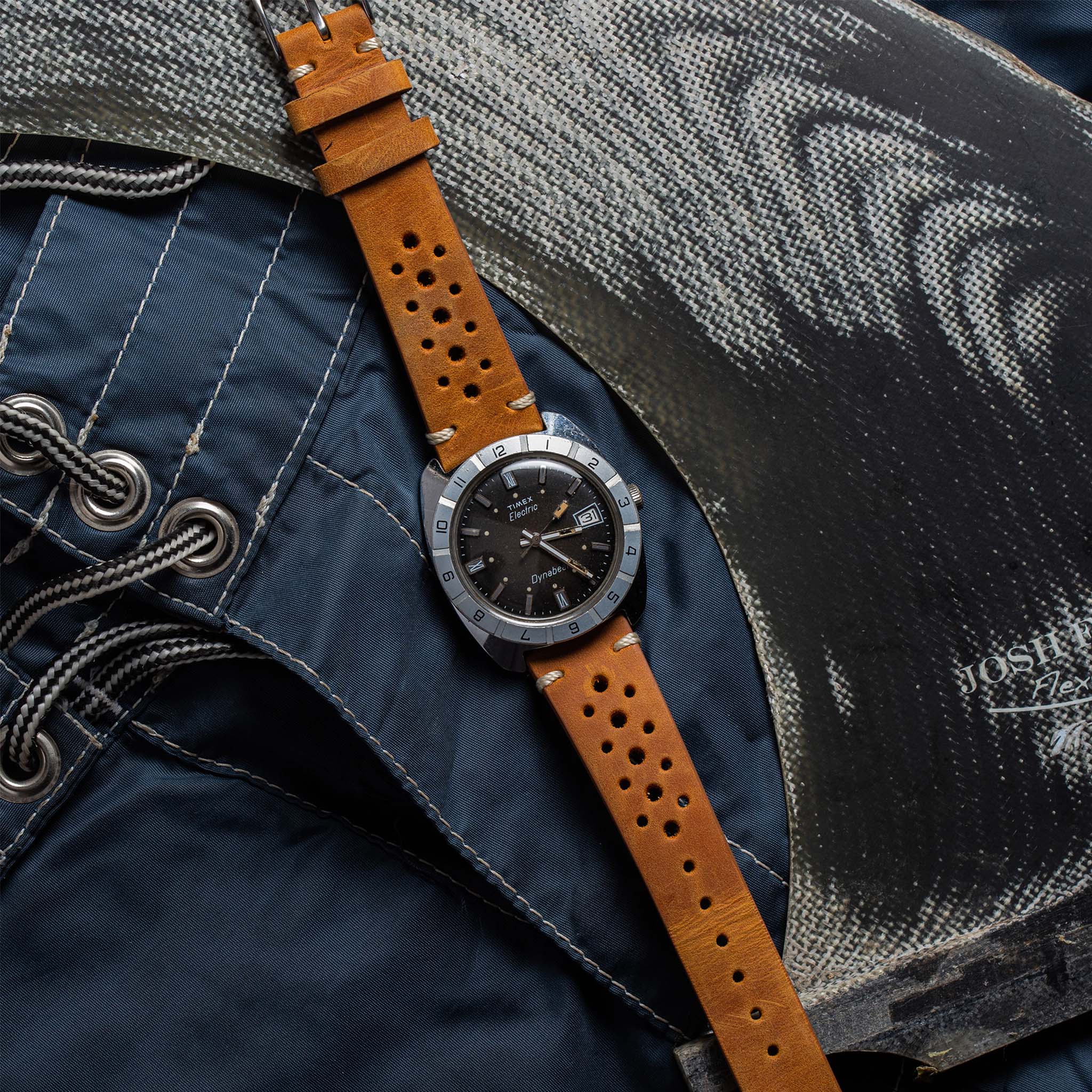 flatlay of the 1976 Timex Electric Dynabeat on a pair of shorts, Accessories by Taylor Stitch