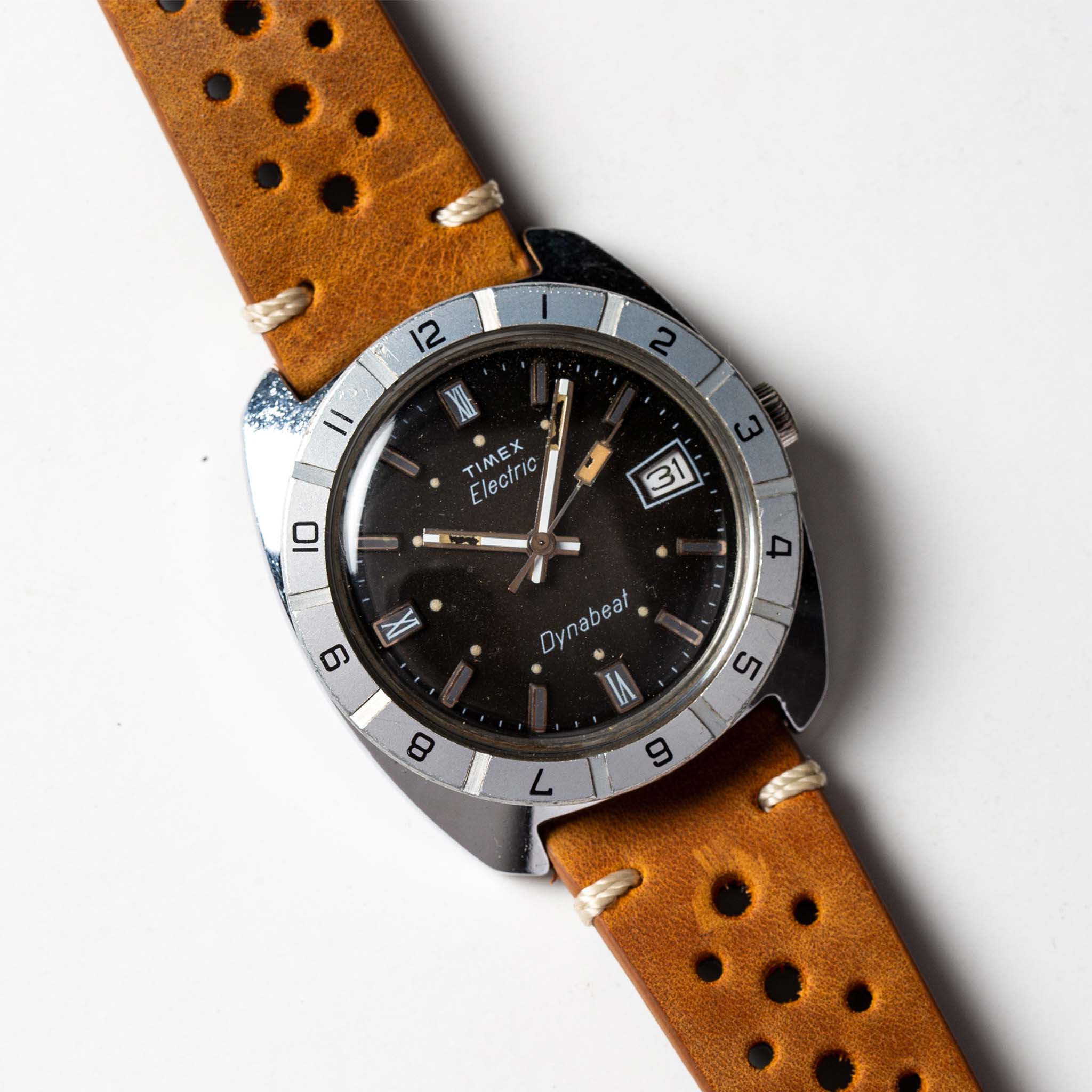 flatlay of 1976 Timex Electric Dynabeat, shown clos eup, Accessories by Taylor Stitch