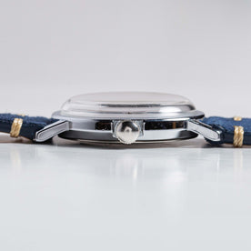 flatlay of the 1976 Timex Mercury Blue, shown from the side