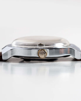 flatlay of the 1977 Timex Marlin, shown from the side, Accessories by Taylor Stitch