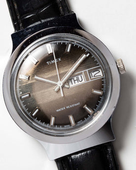 flatlay of the 1977 Timex Marlin M106, shown close up, Accessories by Taylor Stitch