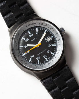flatlay of the 1978 Timex Black Max, shown close up, Accessories by Taylor Stitch