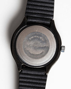 flatlay of the 1978 Timex Black Max, shown from the back, Accessories by Taylor Stitch