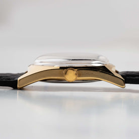 flatlay of the 1978 Timex Gold Marlin, shown from the side