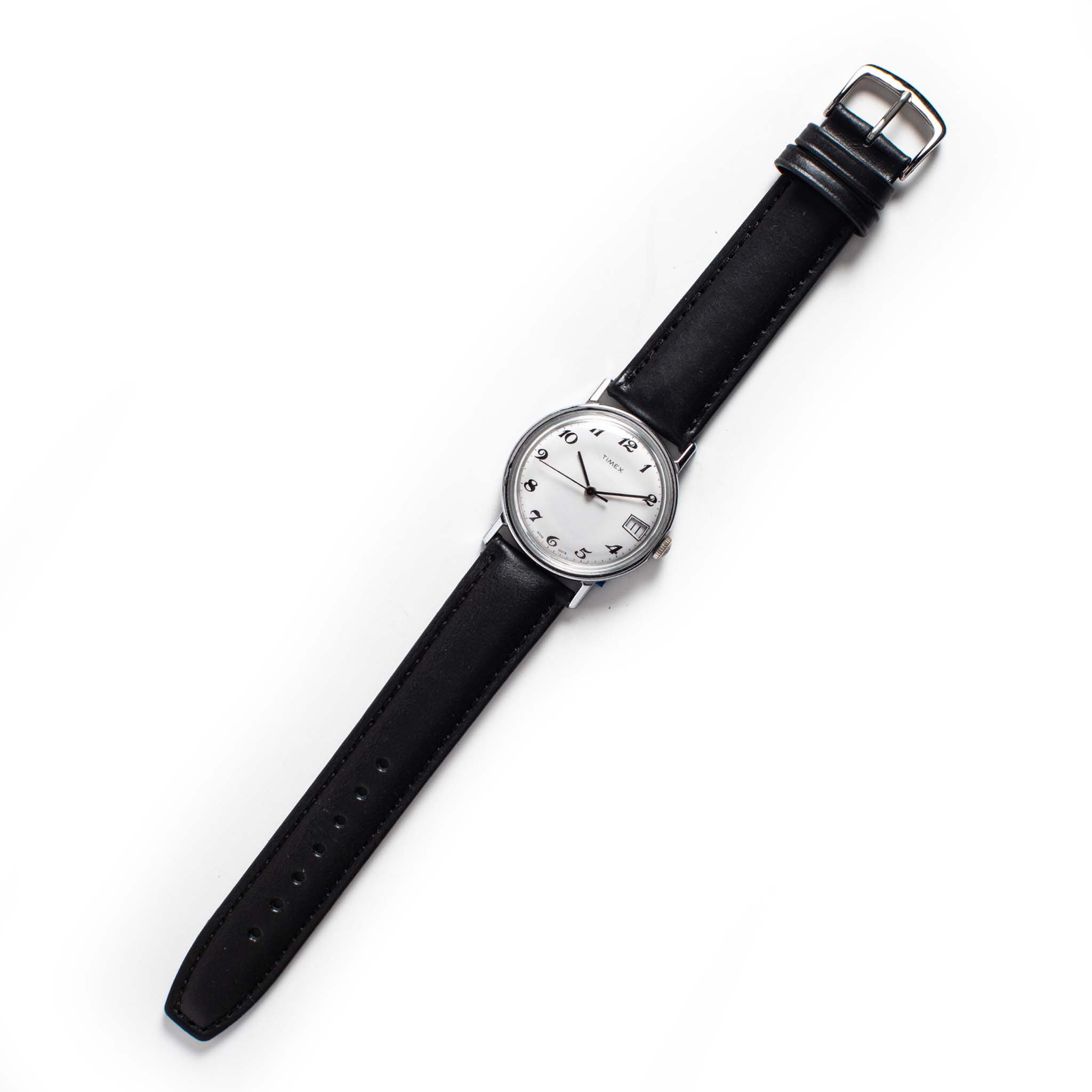 flatlay of the 1978 Timex Mercury, Accessories by Taylor Stitch