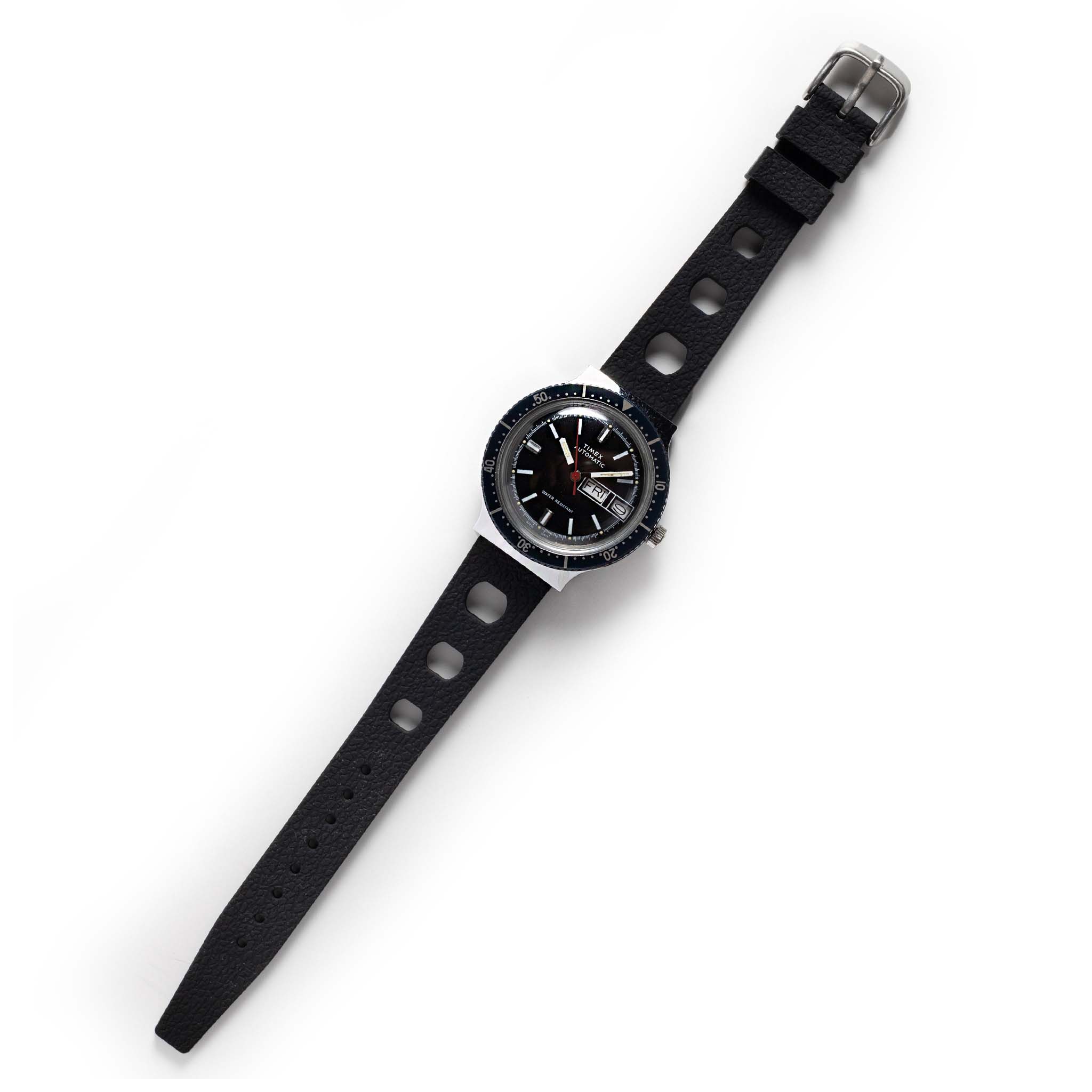 flatlay of the 1978 Timex Viscount M109, Accessories by Taylor Stitch