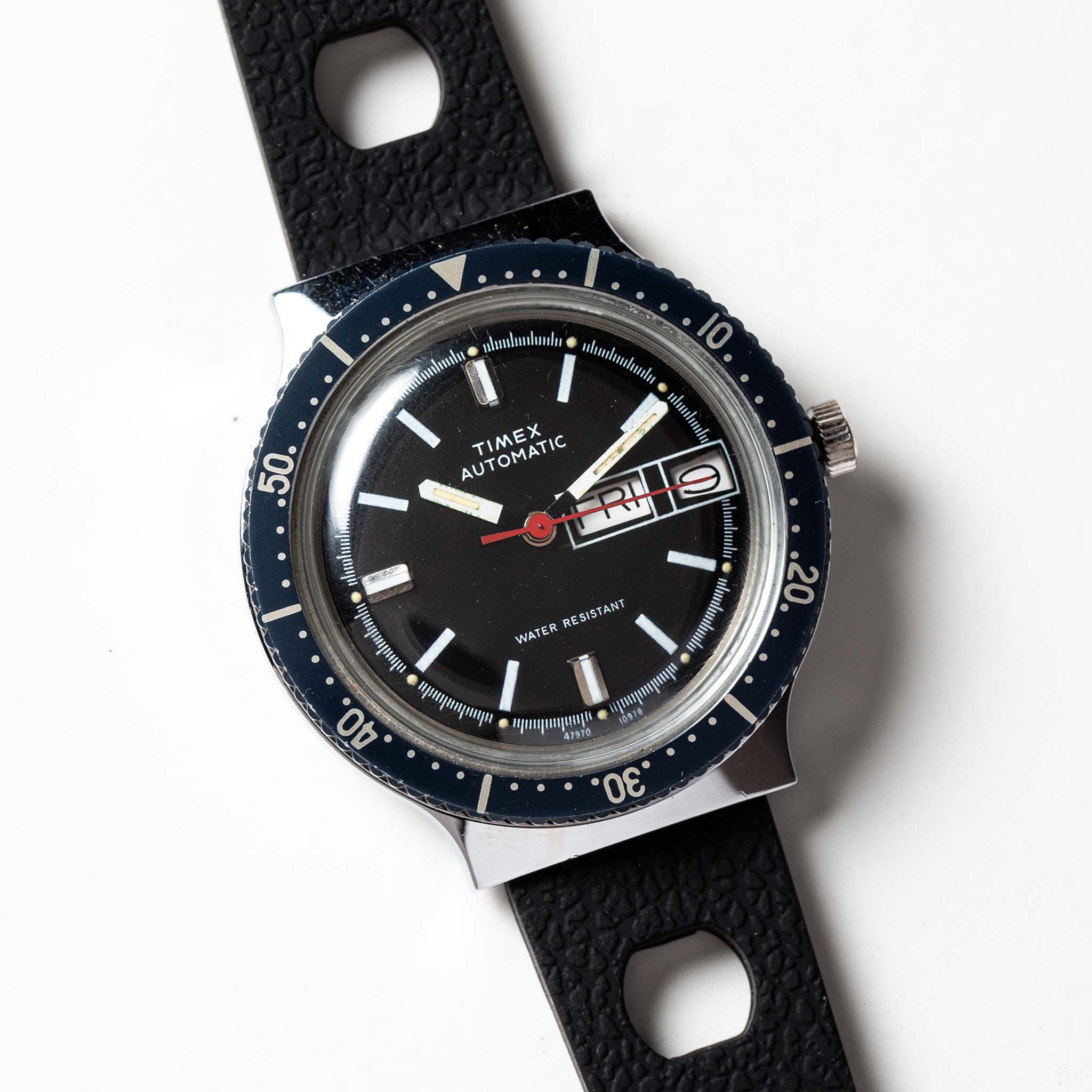 flatlay of the 1978 Timex Viscount M109, shown close up, Accessories by Taylor Stitch