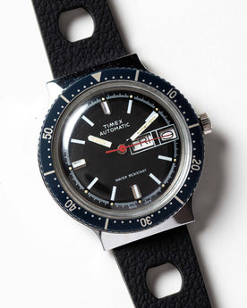 flatlay of the 1978 Timex Viscount M109, shown close up, Accessories by Taylor Stitch