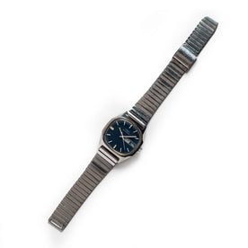 flatlay of the 1981 Timex Viscount, Accessories by Taylor Stitch