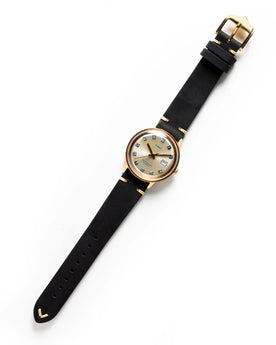 flatlay of the 1975 Timex Viscount, Accessories by Taylor Stitch