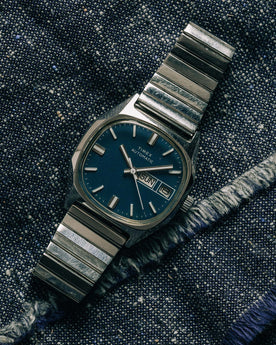 flatlay of the 1981 Timex Viscount, on a denim background, Accessories by Taylor Stitch