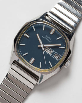 flatlay of the 1981 Timex Viscount, shown close up, Accessories by Taylor Stitch