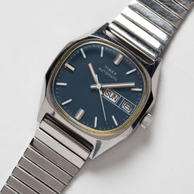 flatlay of the 1981 Timex Viscount, shown close up, Accessories by Taylor Stitch