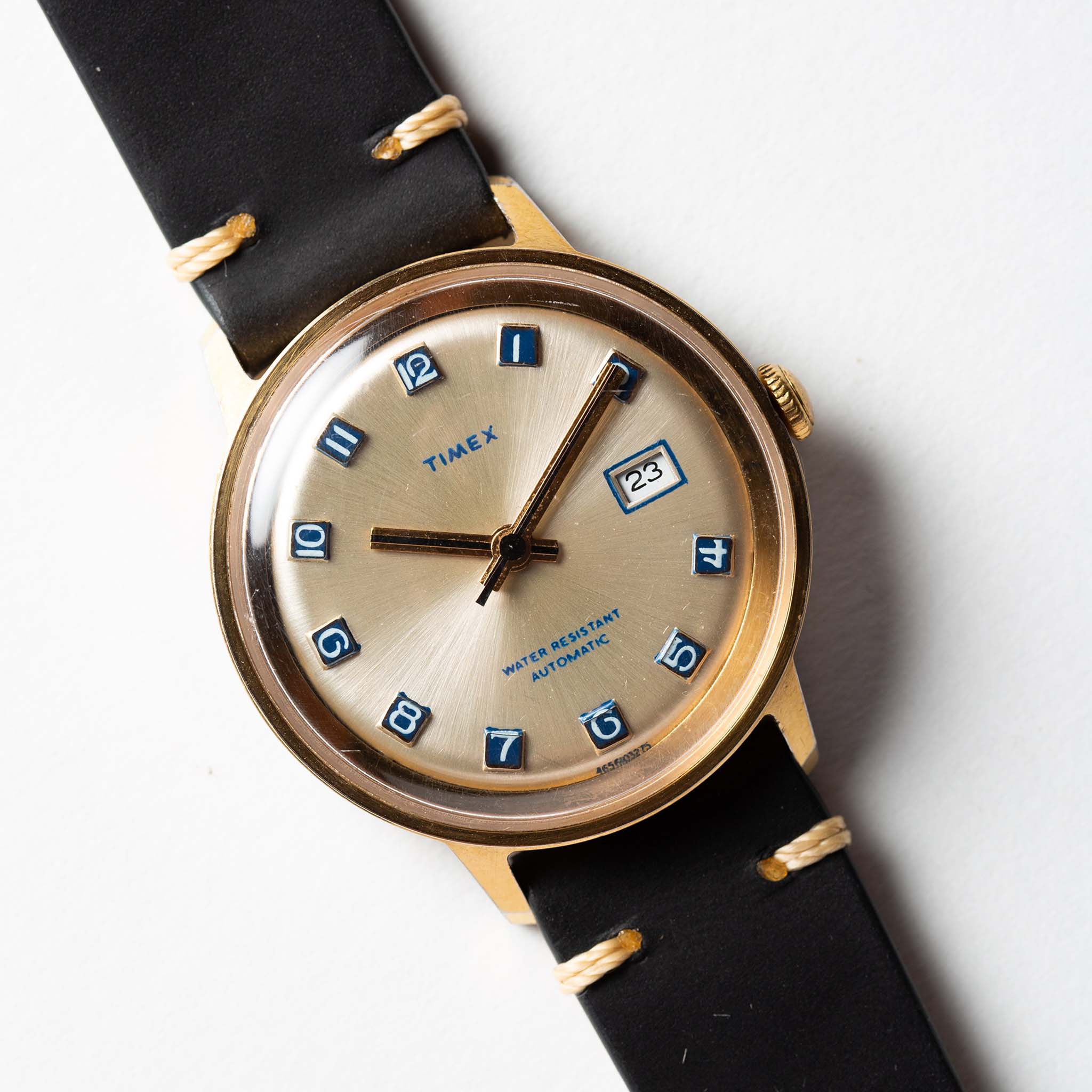 flatlay of the 1975 Timex Viscount, shown close up, Accessories by Taylor Stitch