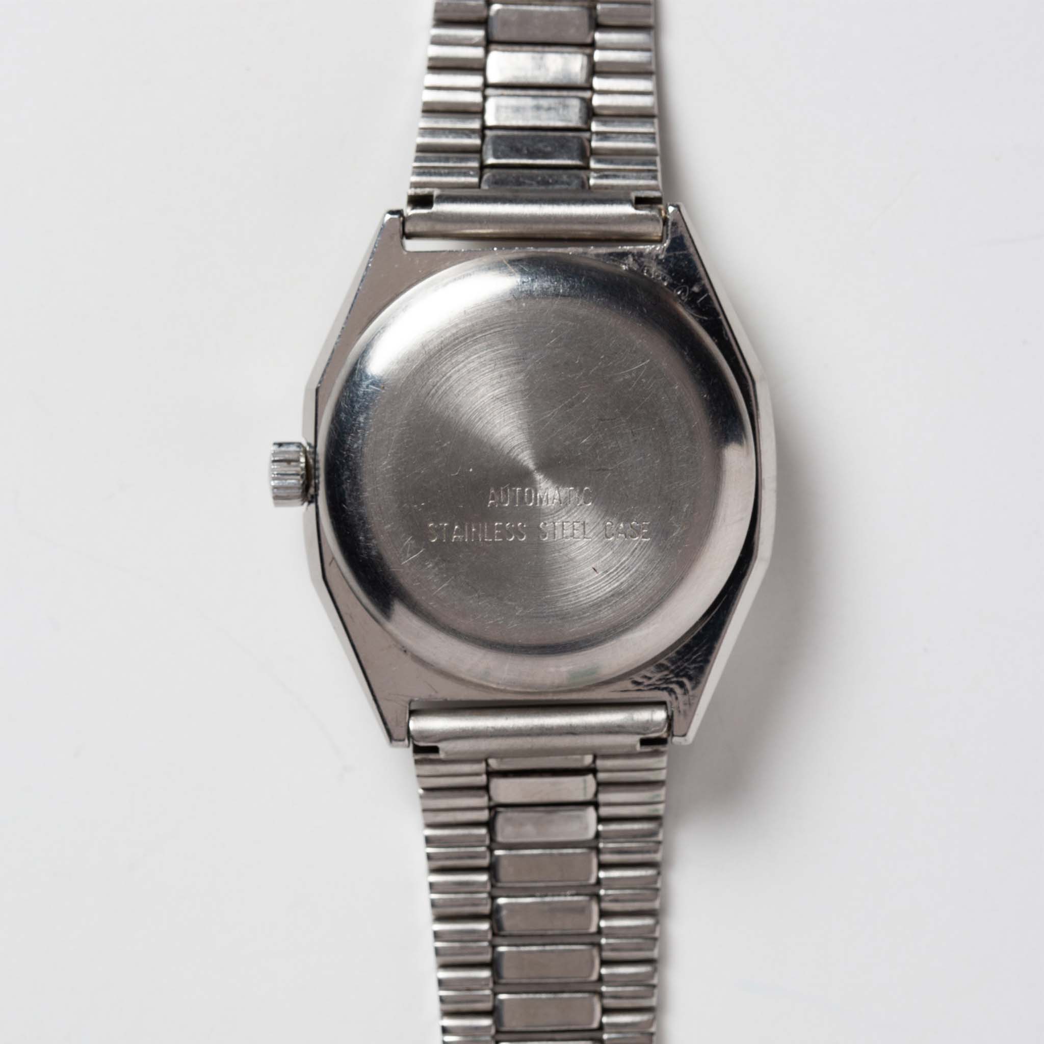 flatlay of the 1981 Timex Viscount, shown from the back, Accessories by Taylor Stitch