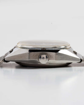 flatlay of the 1981 Timex Viscount, shown from the side, Accessories by Taylor Stitch