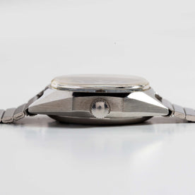 flatlay of the 1981 Timex Viscount, shown from the side, Accessories by Taylor Stitch