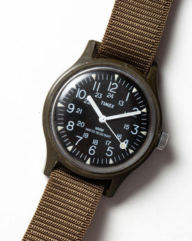 flatlay of the 1991 Timex Camper, shown close up, Accessories by Taylor Stitch