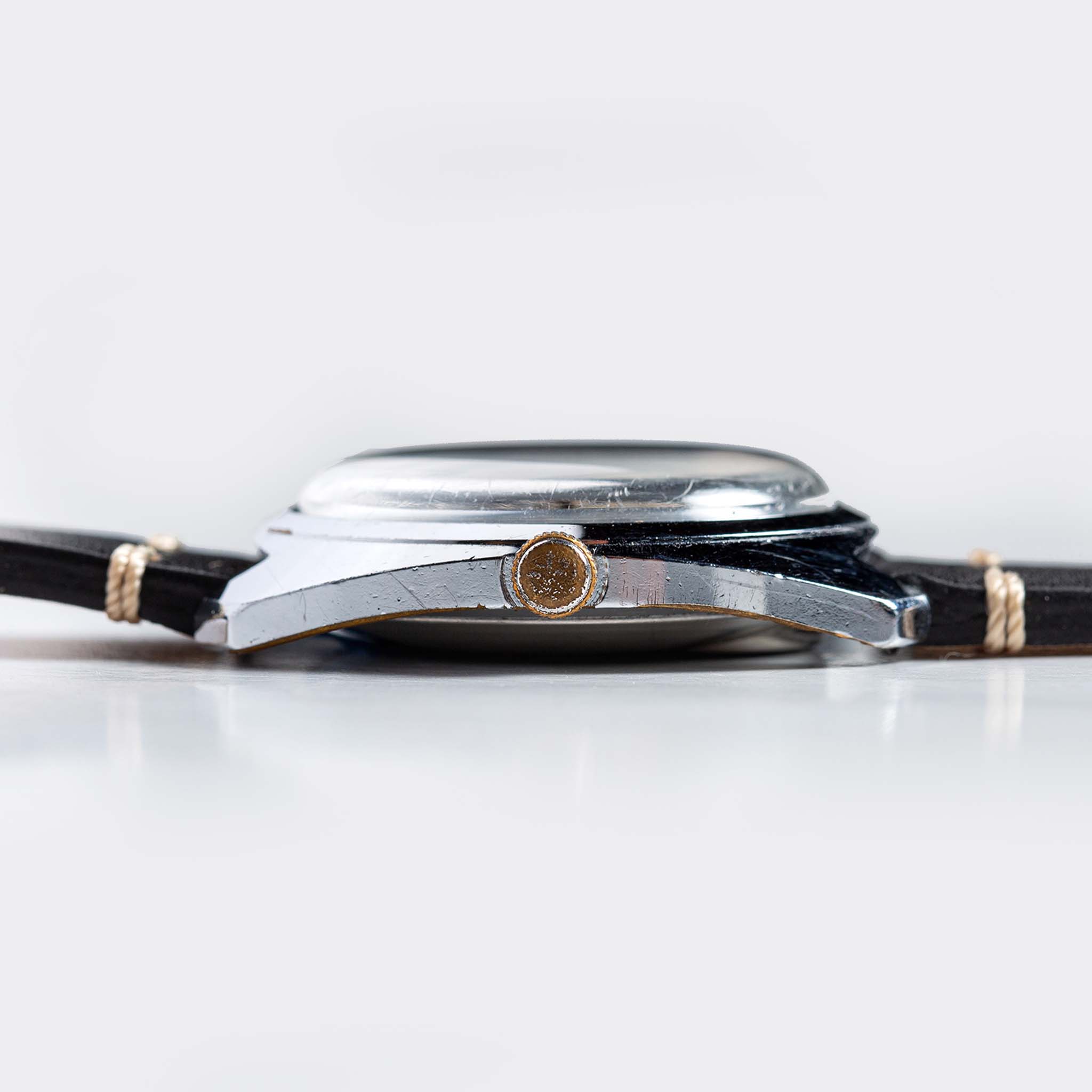 flatlay of 1975 Timex Electric Dynabeat "Rotary", from the side, Accessories by Taylor Stitch