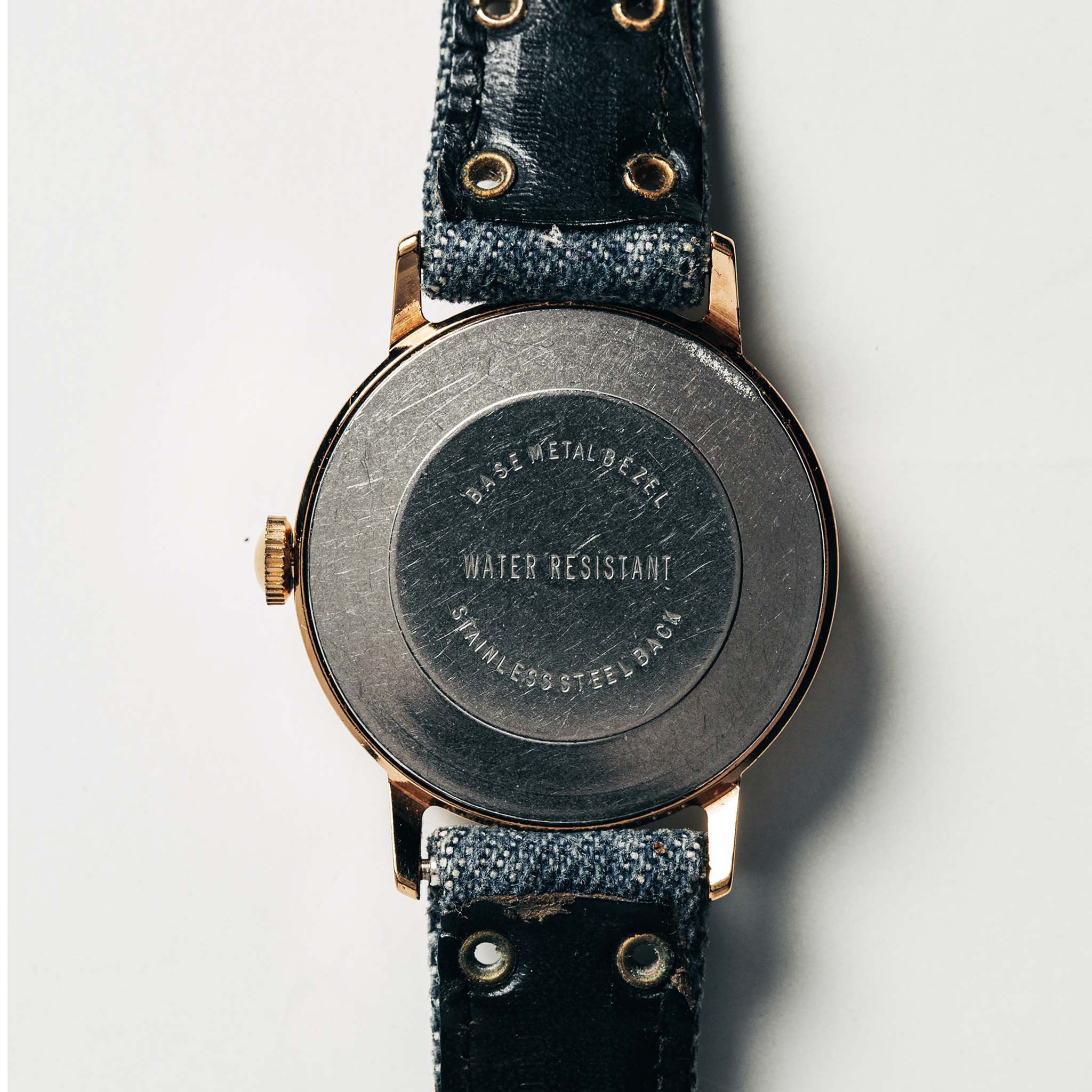 flatlay of the 1978 Timex Mercury "Denim", shown from the back, Accessories by Taylor Stitch