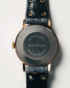 flatlay of the 1978 Timex Mercury "Denim", shown from the back, Accessories by Taylor Stitch