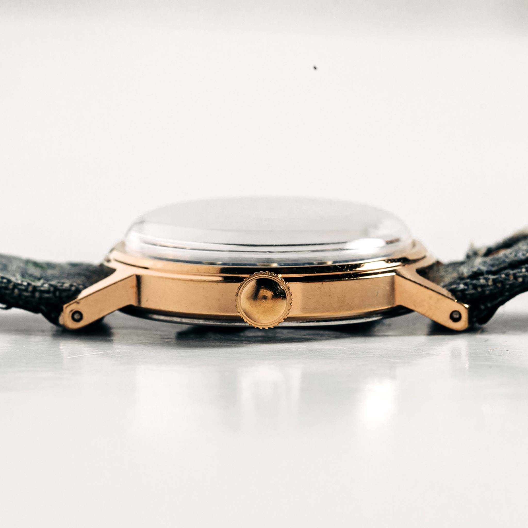 flatlay of the 1978 Timex Mercury "Denim", shown from the side, Accessories by Taylor Stitch